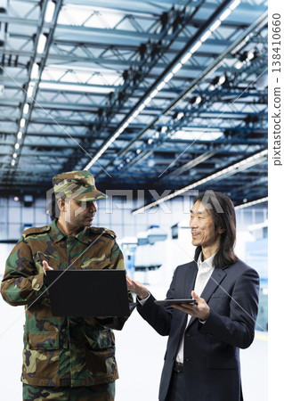 Increase semiconductor self sufficiency, laptop and Indian army man with senior manager. Manufacturing microchips, notebook device and soldier with management executive, national security concept Increase semiconductor self sufficiency, laptop and Indian army man with senior manager. Manufacturing microchips, notebook device and soldier with management executive, national security concept 138410660