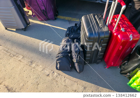Bags and suitcases are on the road. Traveling with luggage and transporting things. High quality photo 138412662