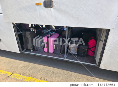 Luggage for travel in the bus luggage compartment. Traveling with the whole family. Bus trips with luggage. . High quality photo Luggage for travel in the bus luggage compartment. Traveling with the whole family. Bus trips with luggage. . High quality photo 138412663