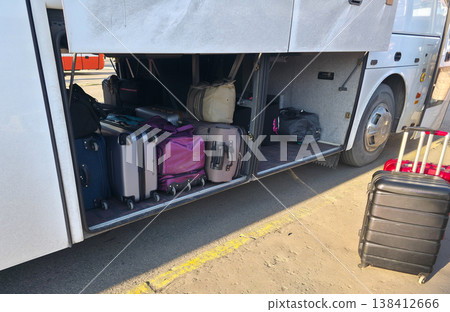 Luggage for travel in the bus luggage compartment. Traveling with the whole family. Bus trips with luggage. . High quality photo 138412666
