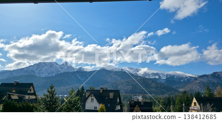 View of the Tatras and Mount Giewont covered with snow. Traveling to the Polish mountains in spring. High quality photo 138412685