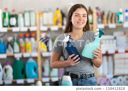 Woman choosing sprays in the store Woman choosing sprays in the store 138412828