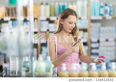 Young woman scanning qr code of paracetamol Young woman scanning qr code of paracetamol 138412838