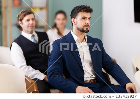 Lecture or meeting participants listen to speaker Lecture or meeting participants listen to speaker 138412927