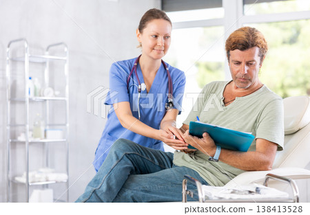Female doctor obtaining consent of patient for medical procedures 138413528
