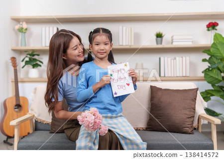 Mother and daughter sharing a heartfelt Mother's Day moment Mother and daughter sharing a heartfelt Mother's Day moment 138414572