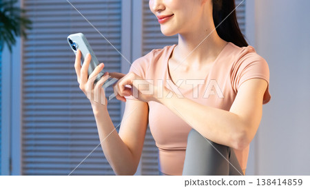 A young lady with a smartphone 138414859