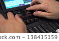 Hands of man turning shuttles on lighting mixer close up 4k 138415159