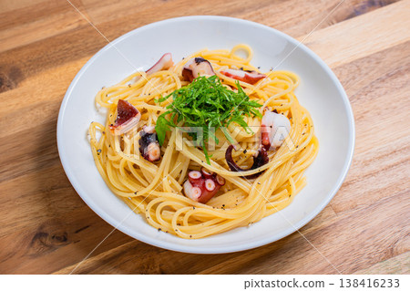 Japanese-style pasta with octopus and perilla leaves, spaghetti with simple seasoning. Japanese-style pasta with octopus and perilla leaves, spaghetti with simple seasoning. 138416233