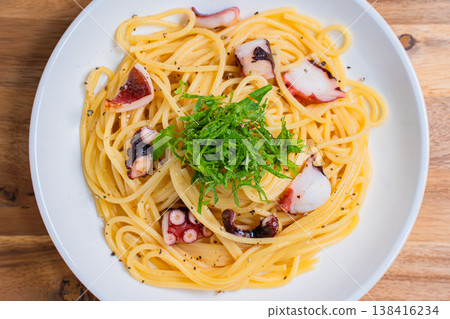 Japanese-style pasta with octopus and perilla leaves, spaghetti with simple seasoning. Japanese-style pasta with octopus and perilla leaves, spaghetti with simple seasoning. 138416234