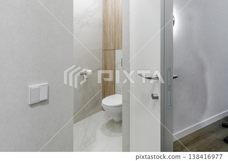 Minimalist Silver Door Handle and Lock Detail on Modern White Door Minimalist Silver Door Handle and Lock Detail on Modern White Door 138416977