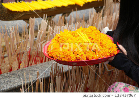 Marigold flower garlands offered for worship at the Erawan Shrine in Bangkok, Thailand. 138417067