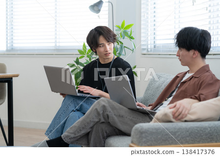 A young male engineer working on his office computer. 138417376