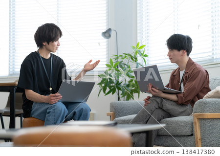 A young male engineer working on his office computer. A young male engineer working on his office computer. 138417380