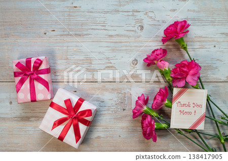 Carnations against a wood grain background Carnations against a wood grain background 138417905