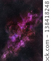 A galaxy in a purple-pink cloud floats above the atmosphere on a black background with sparkling stars. 138418248