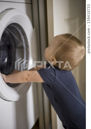 Young Child Reaches Out And Touches Varied Textures Carefully. Infant Hands Carefully Examine And Feel Multiple Textured Materials With Keen Interest And Exploration verical 138418733