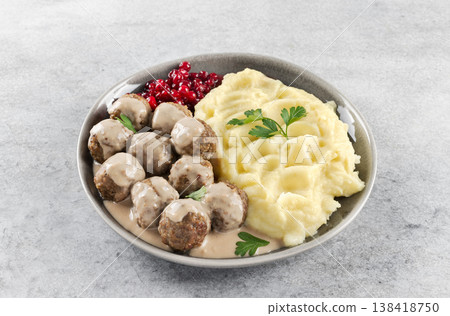 Swedish meatballs with creamy sauce, mashed potatoes and lingonberries. Swedish cuisine 138418750