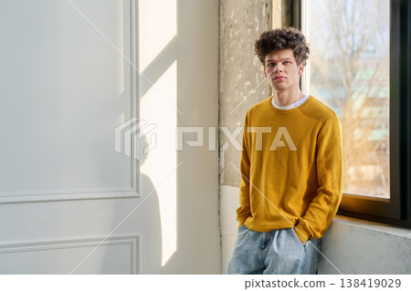 Portrait handsome young man near window, copy space Portrait handsome young man near window, copy space 138419029
