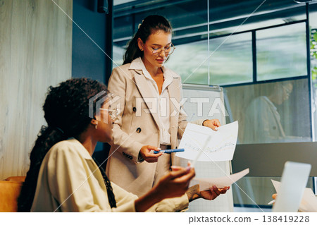Sales lead presents value proposition using slides and laptop at meeting Sales lead presents value proposition using slides and laptop at meeting 138419228