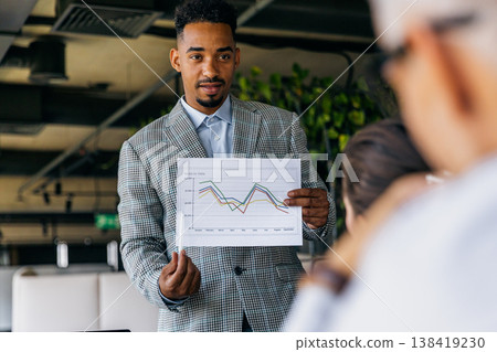 Specialist demonstrates increasing earnings with visuals 138419230