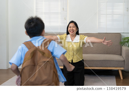 Mother welcoming her son home with open arms Mother welcoming her son home with open arms 138419579