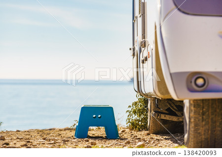 Folding step stool at camper car on camping on sea shore Folding step stool at camper car on camping on sea shore 138420093