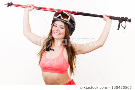 Woman lifting skiing poles. Woman lifting skiing poles. 138420865