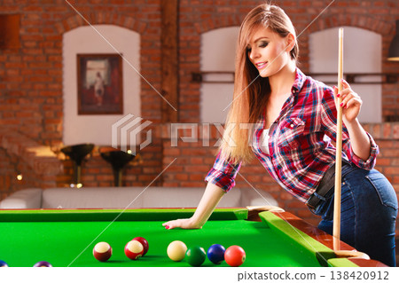 Young woman having fun with billiard. Young woman having fun with billiard. 138420912
