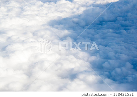 The vast blue sky and clouds skyy. Fluffy clouds from above. White clouds against blue skies background. High quality photo 138421551