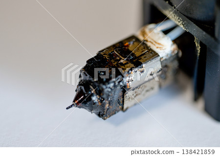 Selective focus on charred and plugged hot end extruder of a 3D filament printer Selective focus on charred and plugged hot end extruder of a 3D filament printer 138421859