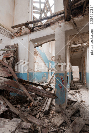 Abandoned Building Interior With Broken Walls, Debris Pile, Blue Paint Remnants, Exposed Beams, Ruined Corridor And Dilapidated Staircase In Decay 138422354