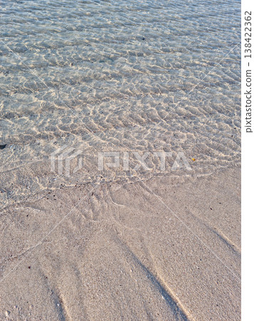 Sandy beach and clear sea water 138422362