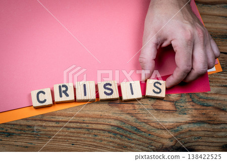 CRISIS Economic And Social Pressure Concept Shown With Wooden Letter Blocks 138422525