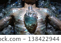 Conceptual art on ocean plastic pollution and environment. Man with plastic scales and a glass heart containing a small fish, lying among empty plastic bottles 138422944