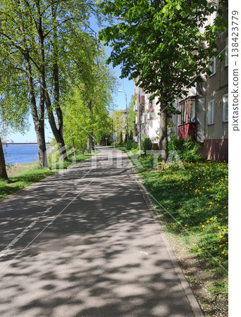 Modern cityscape with natural green spaces in springtime. Ideal for eco-friendly visuals, tourism imagery, and editorial design. Modern cityscape with natural green spaces in springtime. Ideal for eco-friendly visuals, tourism imagery, and editorial design. 138423779