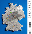 Miniature cityscape shaped as Germany map on flat background - ai generated 138423876