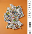 Miniature cityscape shaped as Germany map on flat background - ai generated 138423889