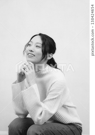 A monochrome, retro-style portrait of a daughter returning to her family home. A monochrome, retro-style portrait of a daughter returning to her family home. 138424654