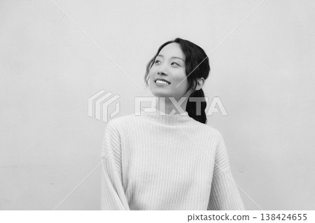 A monochrome, retro-style portrait of a daughter returning to her family home. A monochrome, retro-style portrait of a daughter returning to her family home. 138424655