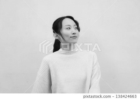 A monochrome, retro-style portrait of a daughter returning to her family home. A monochrome, retro-style portrait of a daughter returning to her family home. 138424663