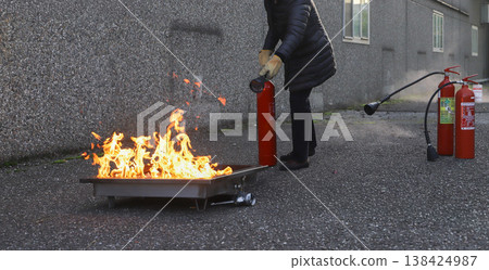 fire prevention. corporate safety - exercise during a firefighting course fire prevention. corporate safety - exercise during a firefighting course 138424987