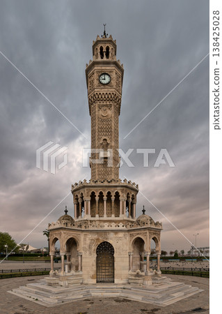 Iconic Izmir Clock Tower in Konak Square, Izmir, Turkey, showcasing beautiful Ottoman architecture under a cloudy sky 138425028