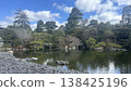 Traditional Japanese garden landscape with pond and pine trees, blue sky and white clouds - background material 138425196