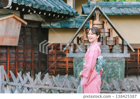 A young woman in a kimono visiting sightseeing spots in Kyoto A young woman in a kimono visiting sightseeing spots in Kyoto 138425387