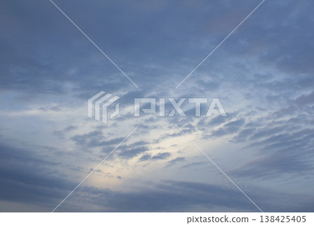 It is a sunset sky with flocks of clouds. It is a sunset sky with flocks of clouds. 138425405