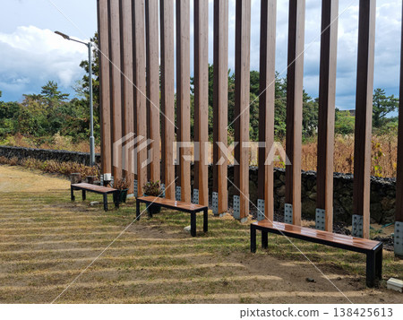 This is an outdoor park with benches. 138425613