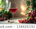 Vineyard culture. Classy aesthetic. Elegant Wine Glass filled with red wine on white background. 138426192