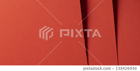 Vibrant orange red designer paper forms a bold saturated background. Smooth matte satin surface 138426930