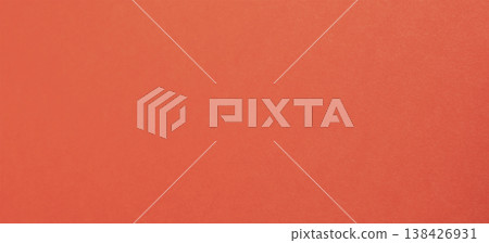 Vivid orange red paper, background with refined warmth. Smooth satin surface shows subtle metallic 138426931